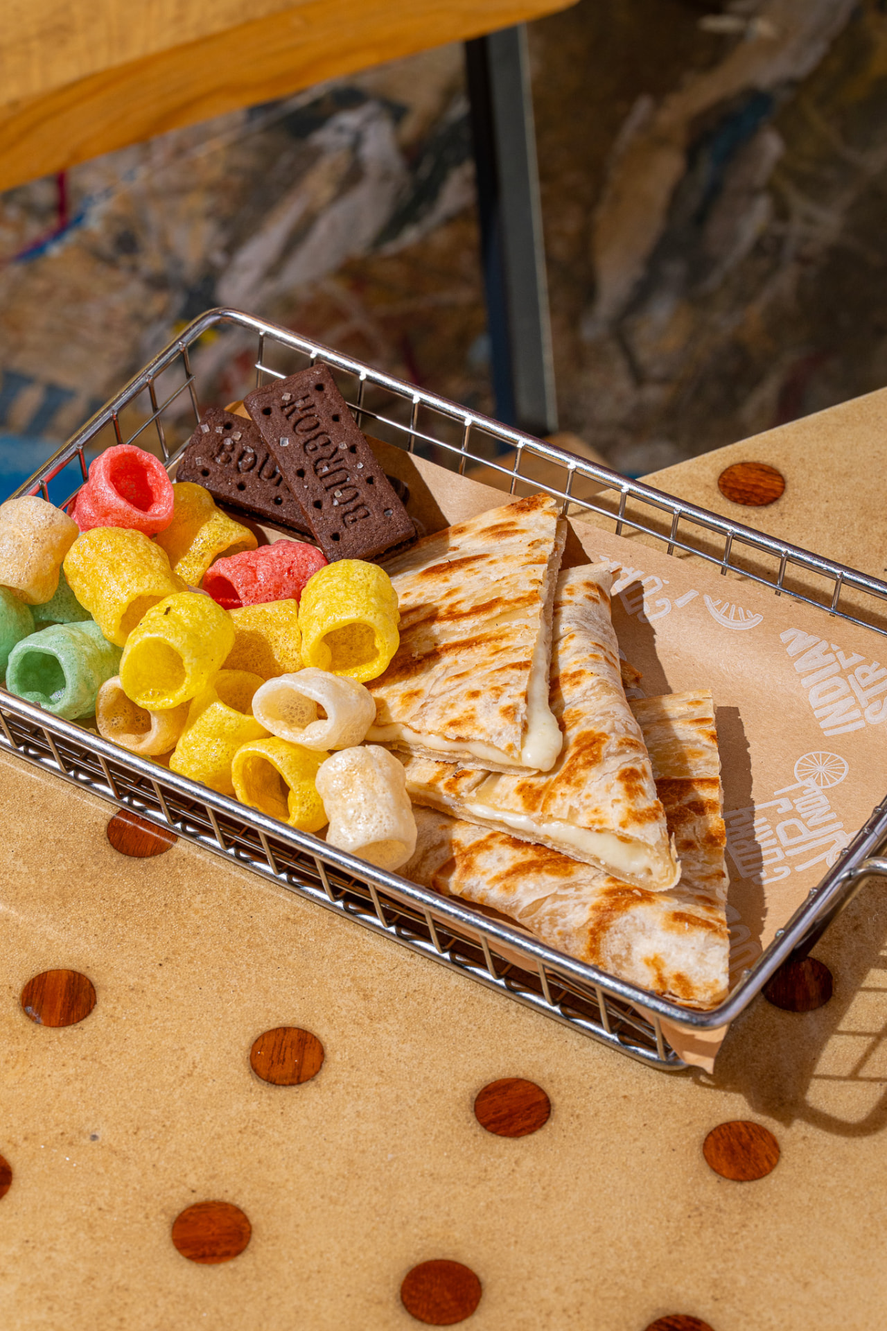 Kids cheese quesadilla basket with fryums and a bourbon biscuit
