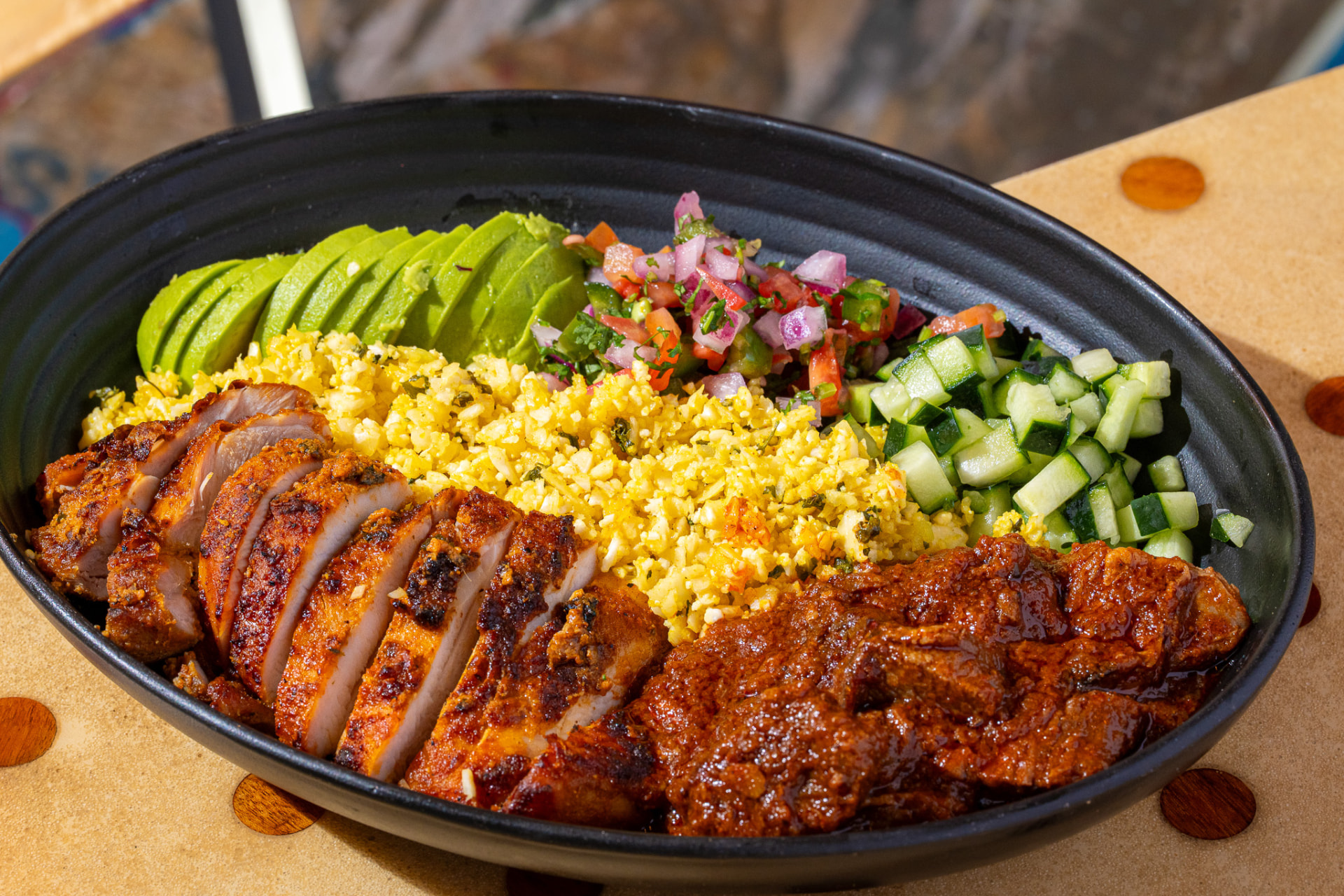 Performance protein bowl: tandoori chicken, cauliflower rice, avocado, pico, cucumber