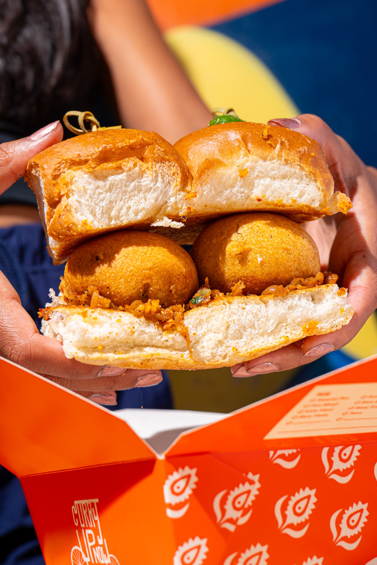 Vada Pav, two held in hand