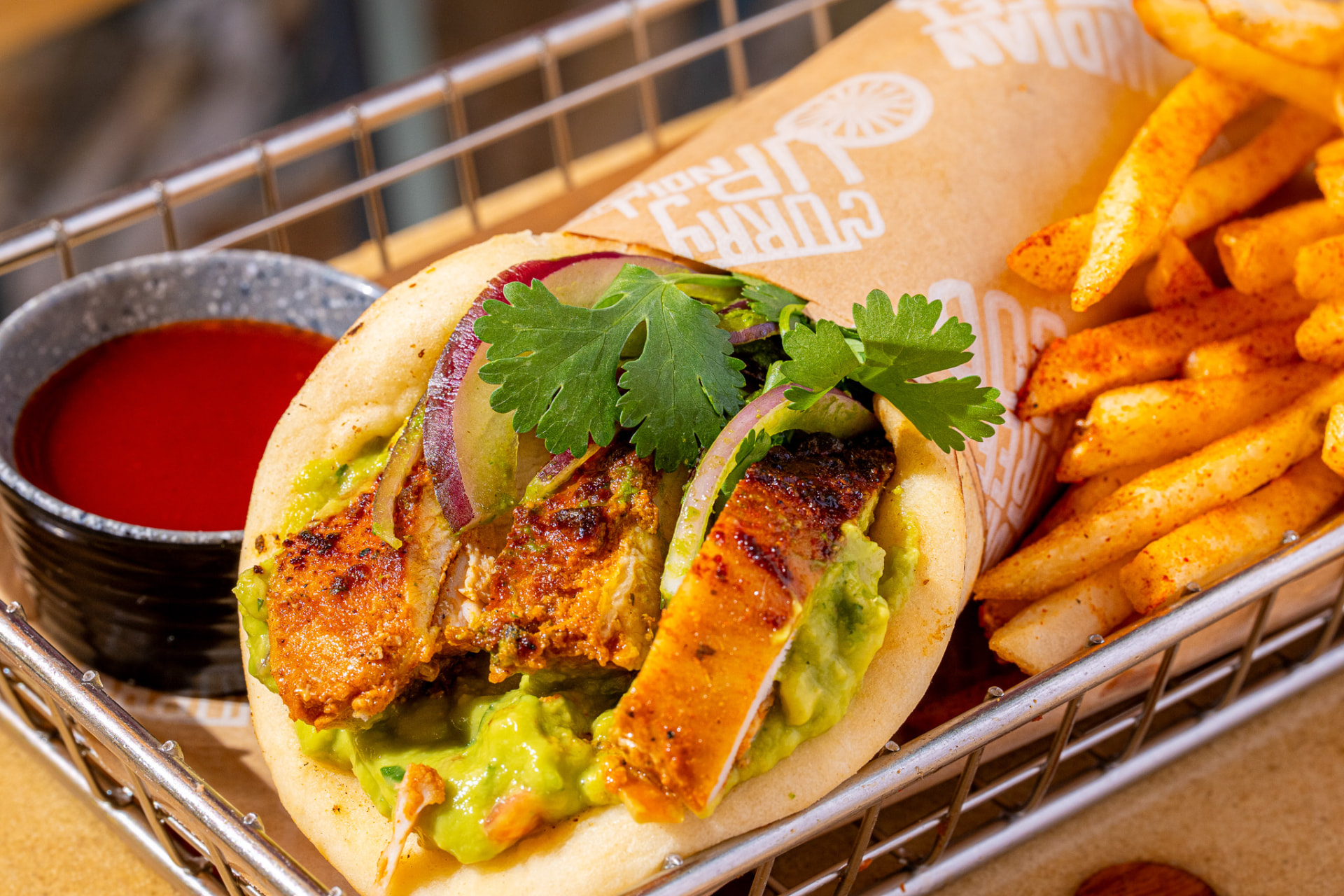 El Jefe with peri-peri fries, angled close up