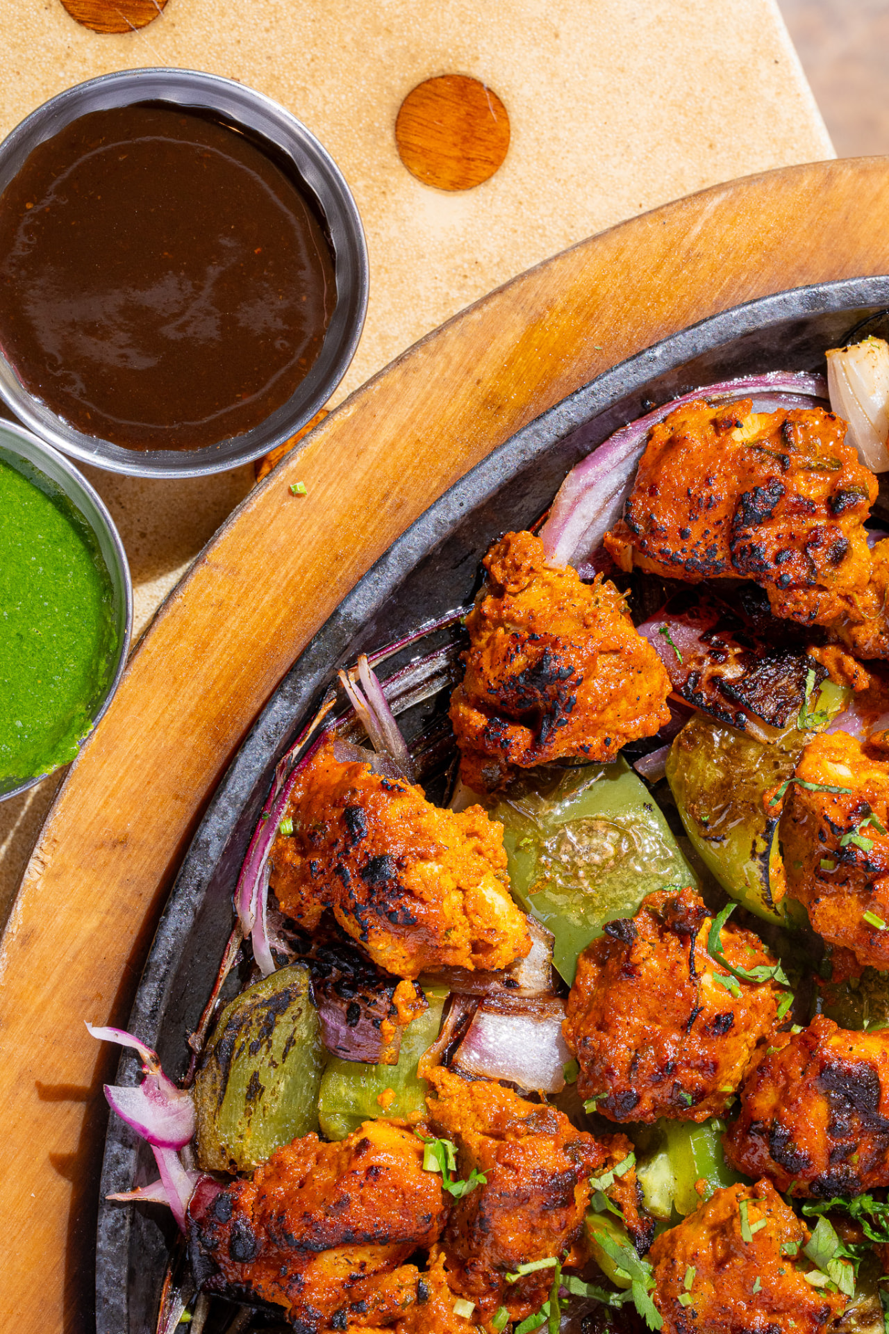 Sizzlin Kabab, close up with tamarind and cilantro chutneys