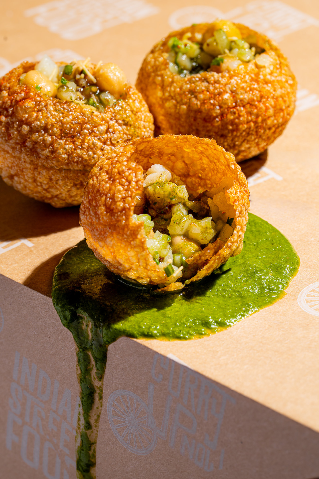Pani Puri filled, with green pani pour