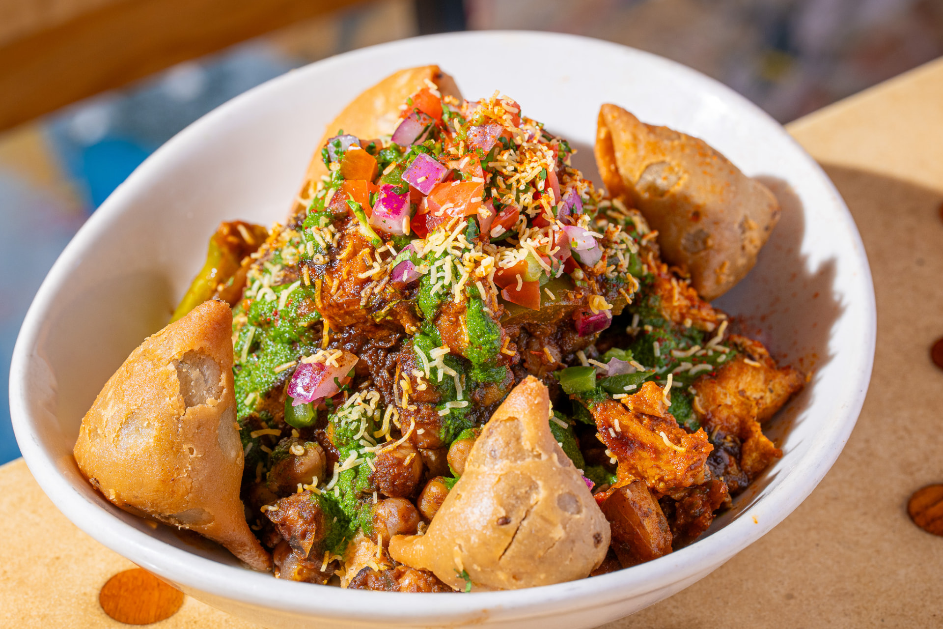 Deconstructed Samosa bowl, angled with protein and mini samosas