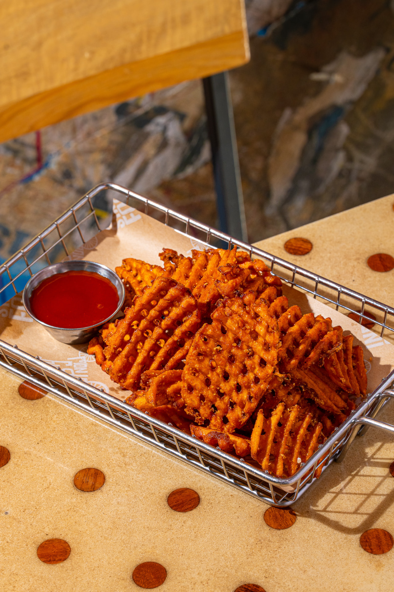 Sweet potato waffle fries with a side of sauce