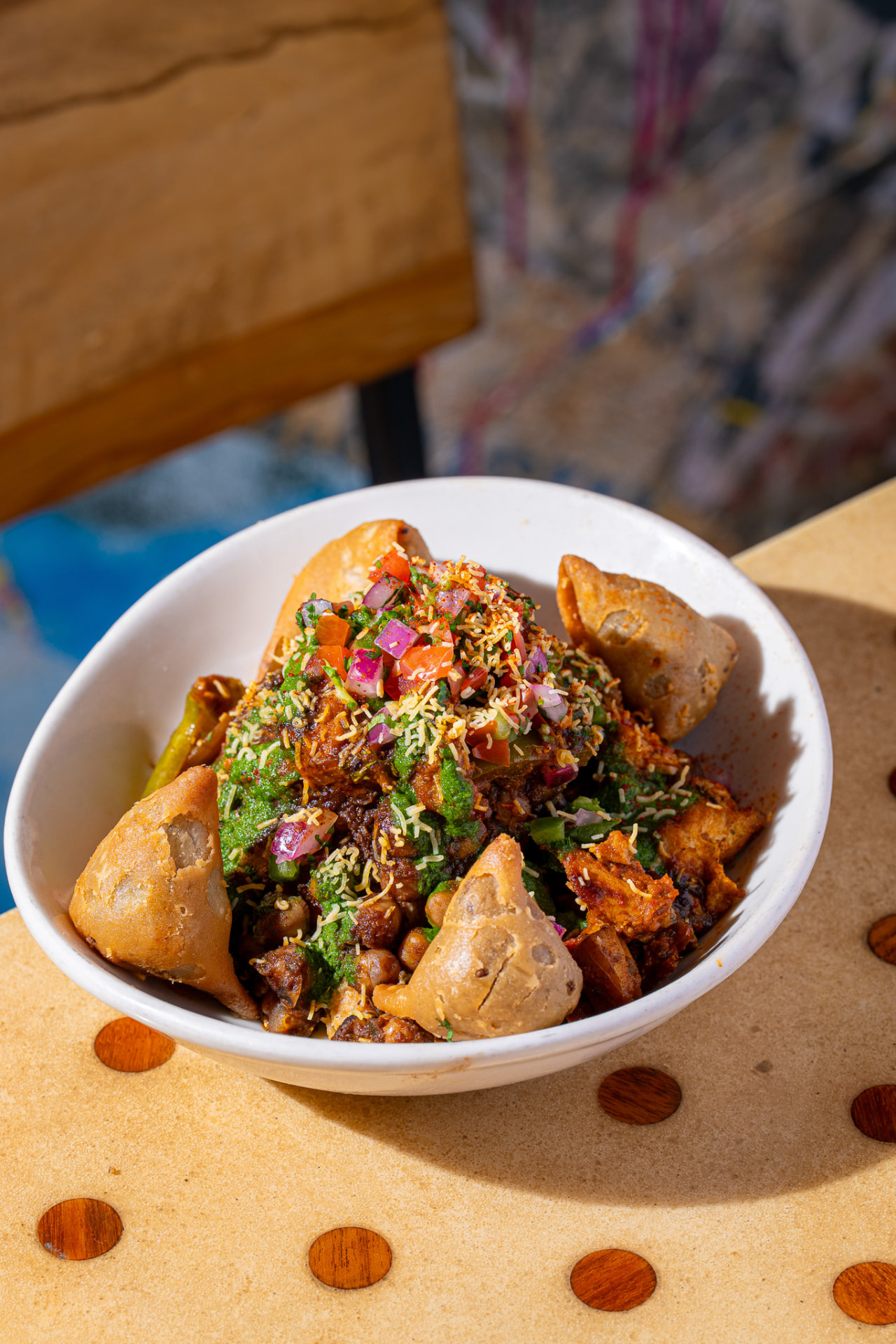 Deconstructed Samosa bowl, overhead with mini samosas and cilantro chutney
