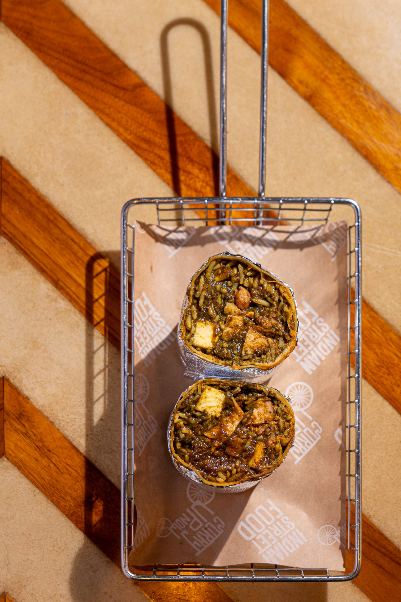 Punjabi by Nature burrito, both halves in the basket
