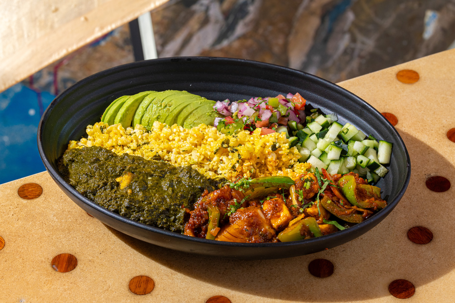 Keto bowl: paneer tikka, saag, cauliflower rice, avocado, pico, cucumber