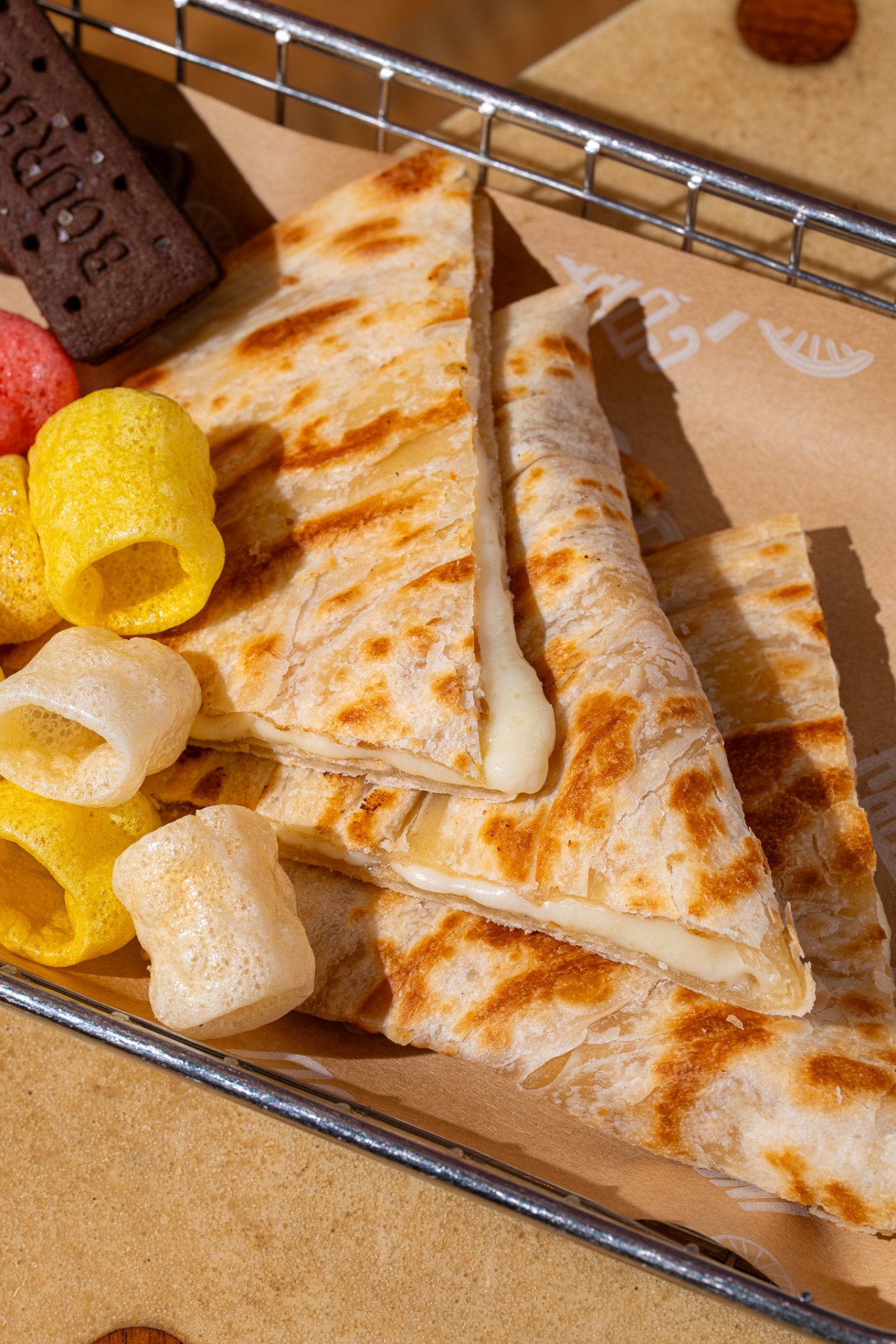 Kids cheese quesadilla, close up on the cheese pull
