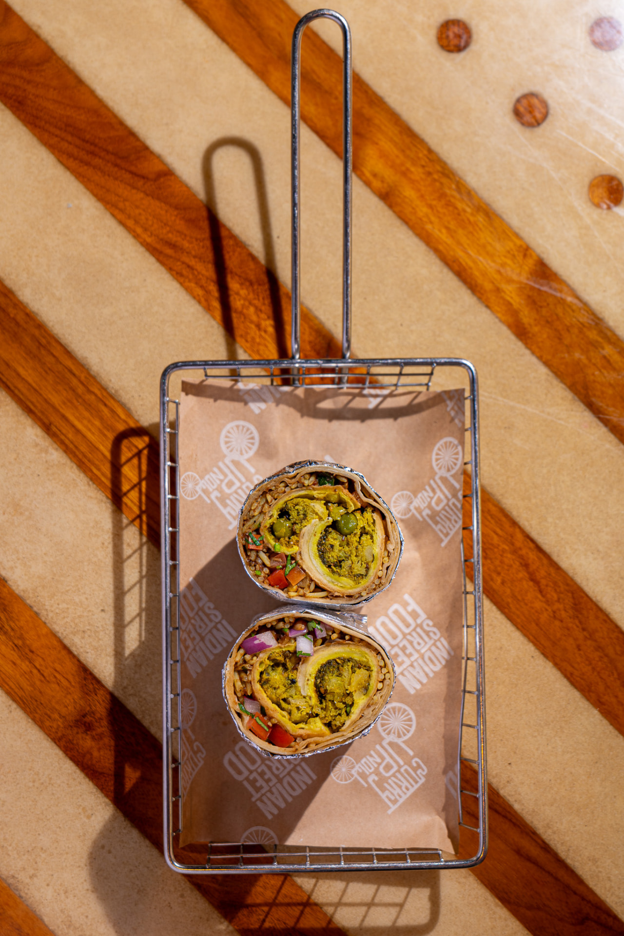 Hella Vegan burrito in the basket, overhead