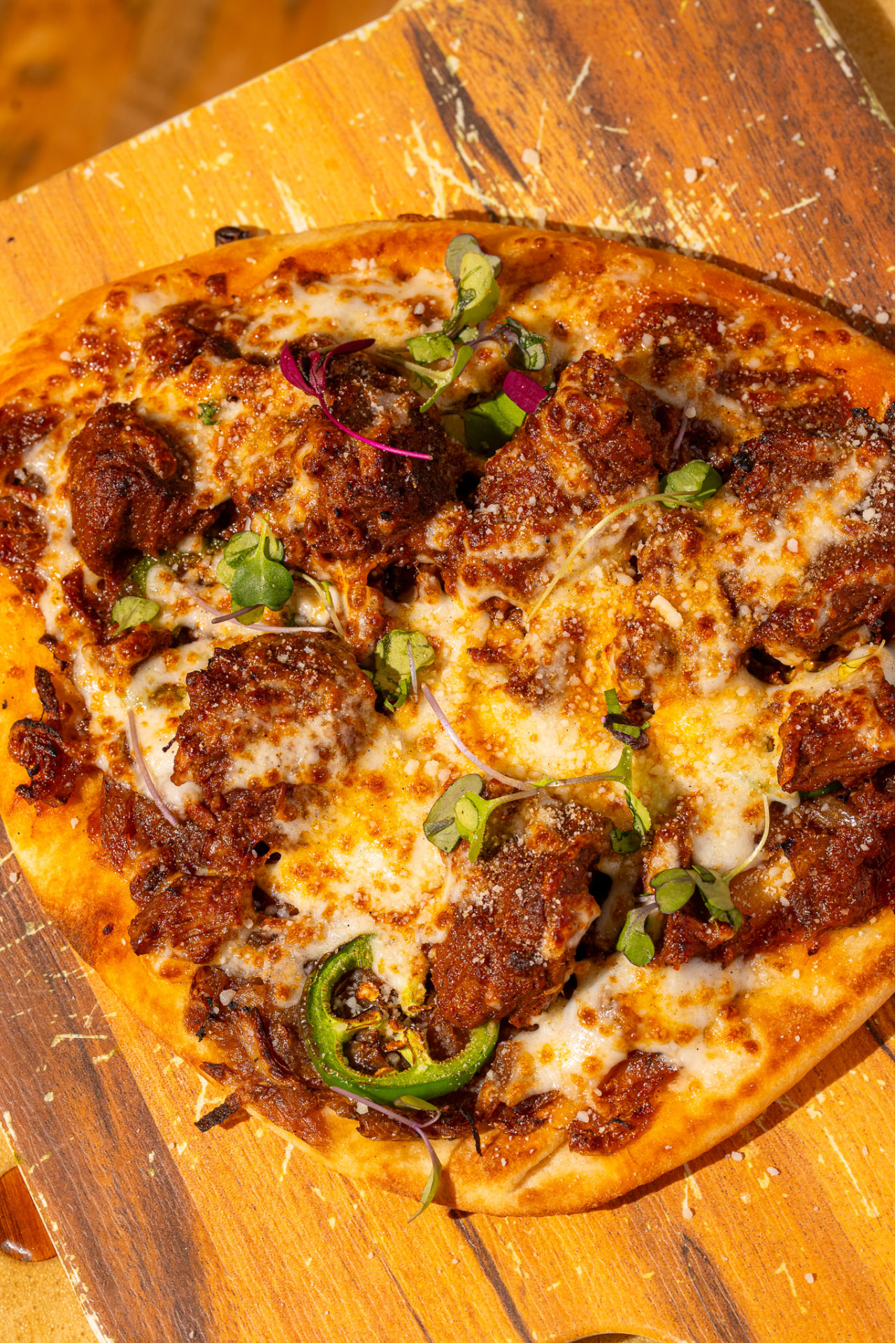 Naughty Naan, close up with jalapeno and micro greens