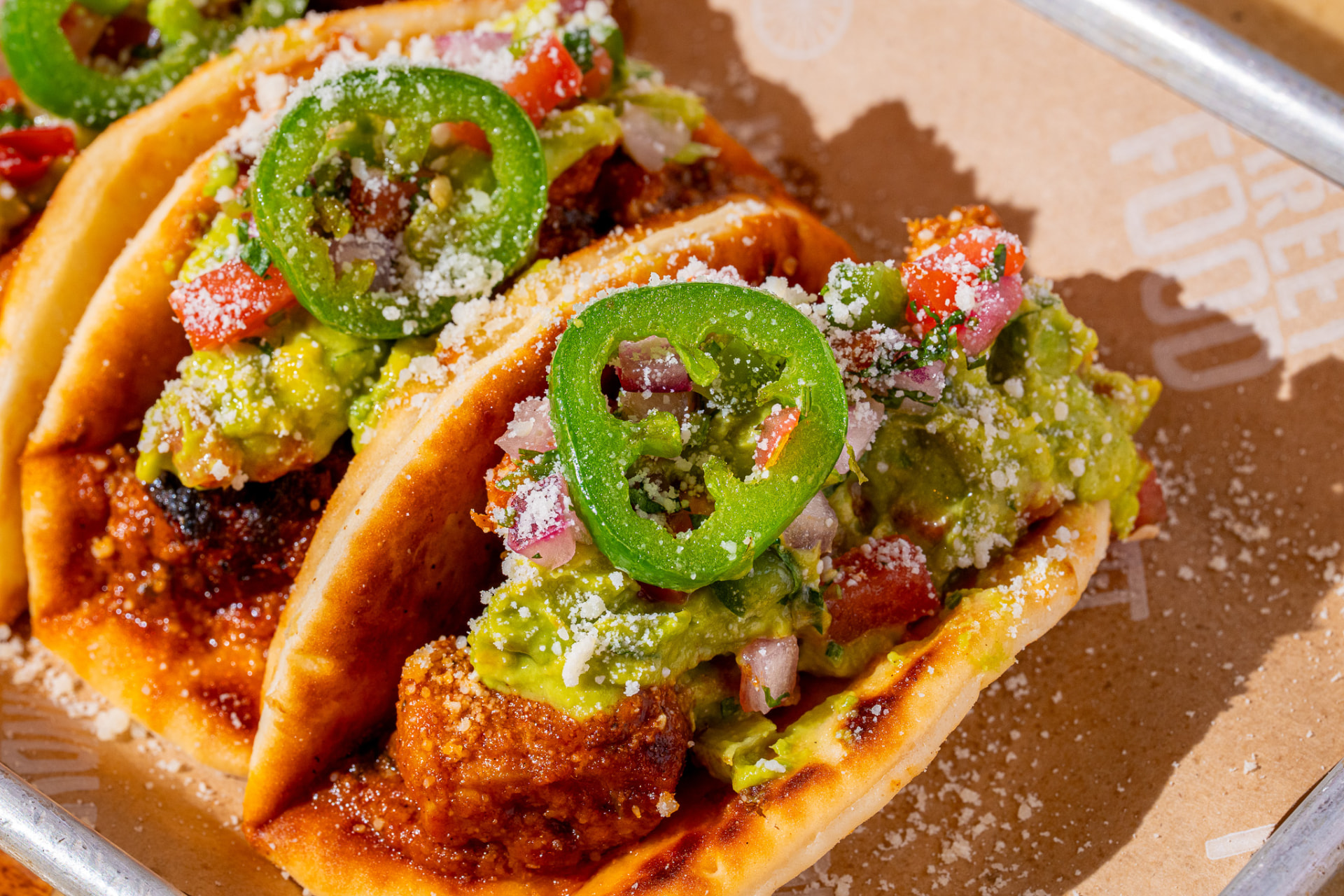 Tacos, two on the tray