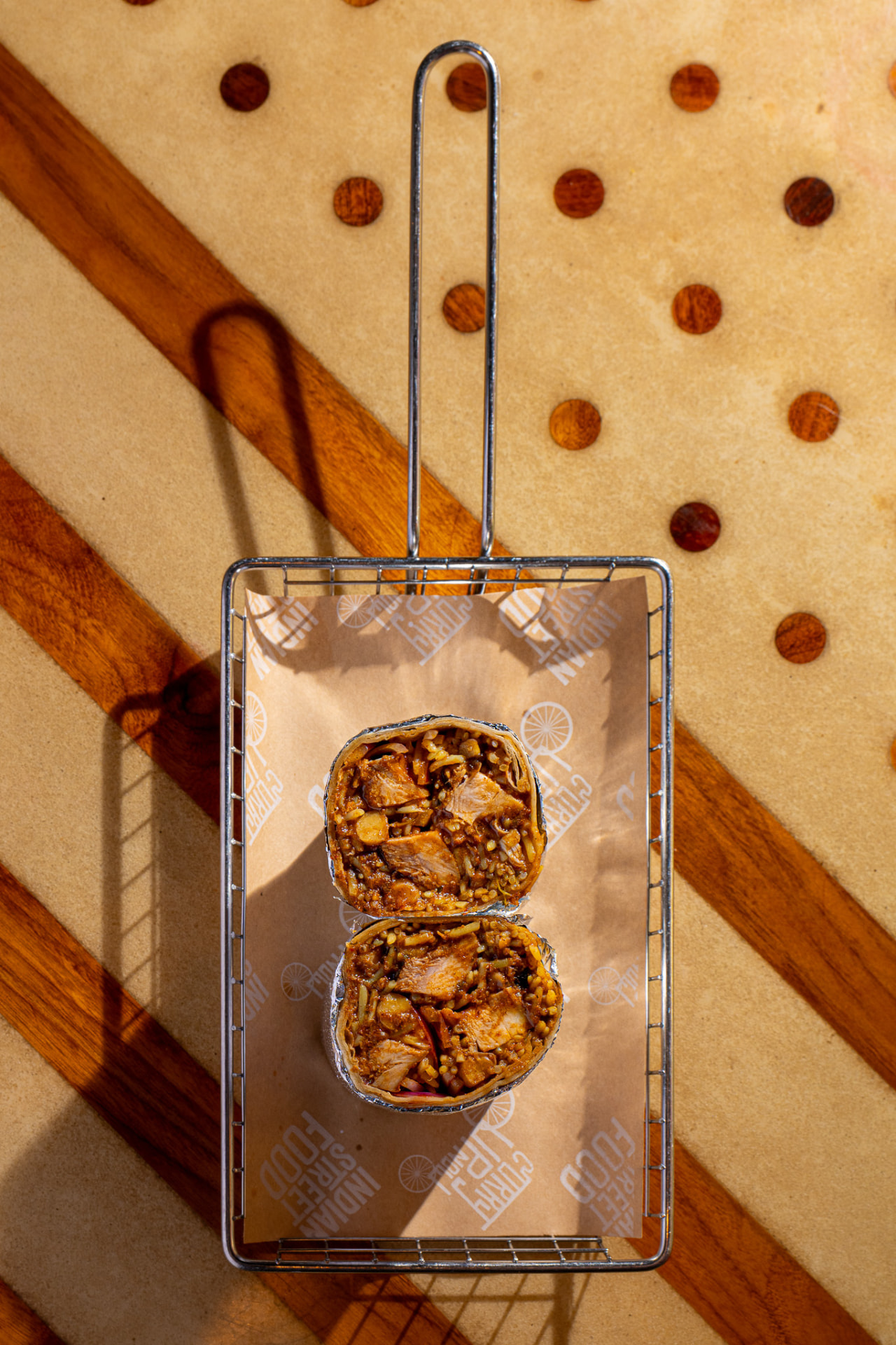 Chicken tikka burrito in the basket, overhead