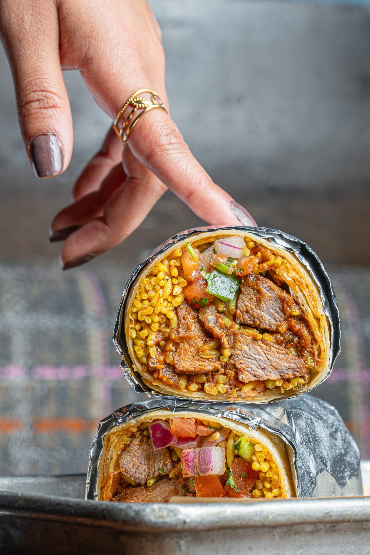 Vindaloo burrito, hand held