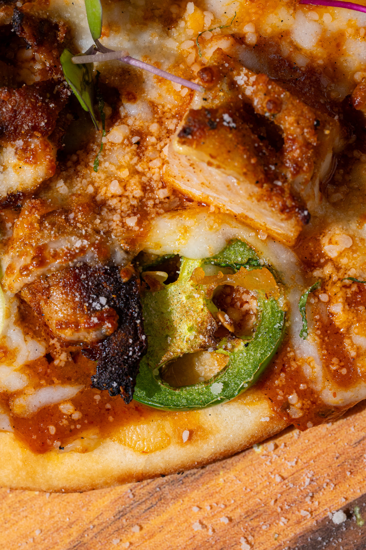 Chicken Naughty Naan, extreme macro on jalapeno and melted cheese