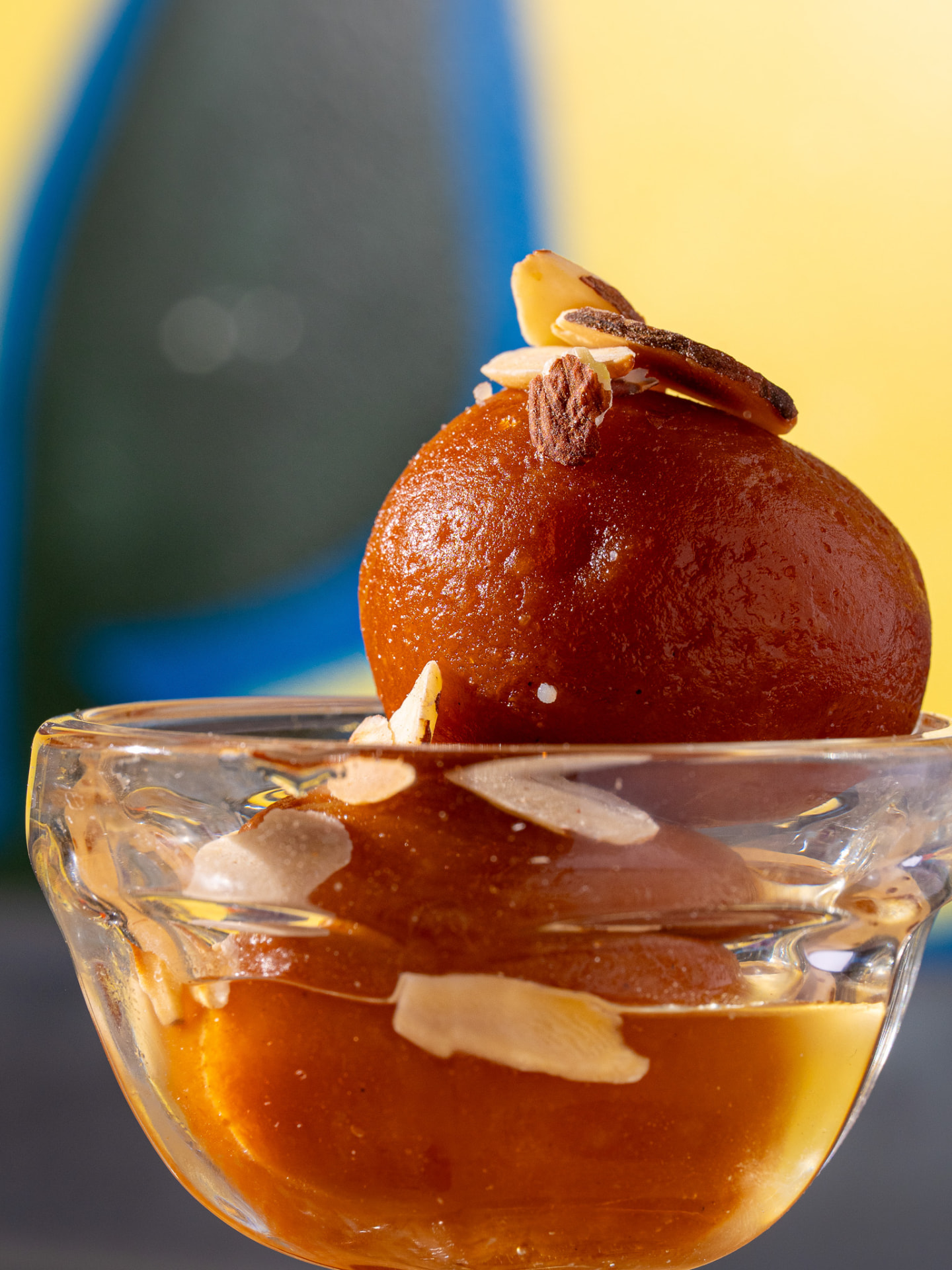 Gulab jamun in syrup, side view