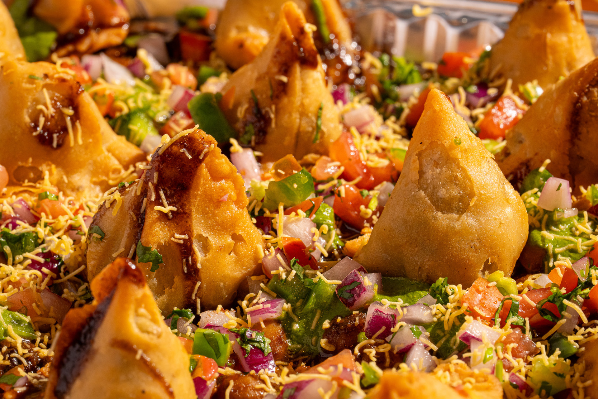Samosa Chaat tray, overhead with pico, chutneys and sev