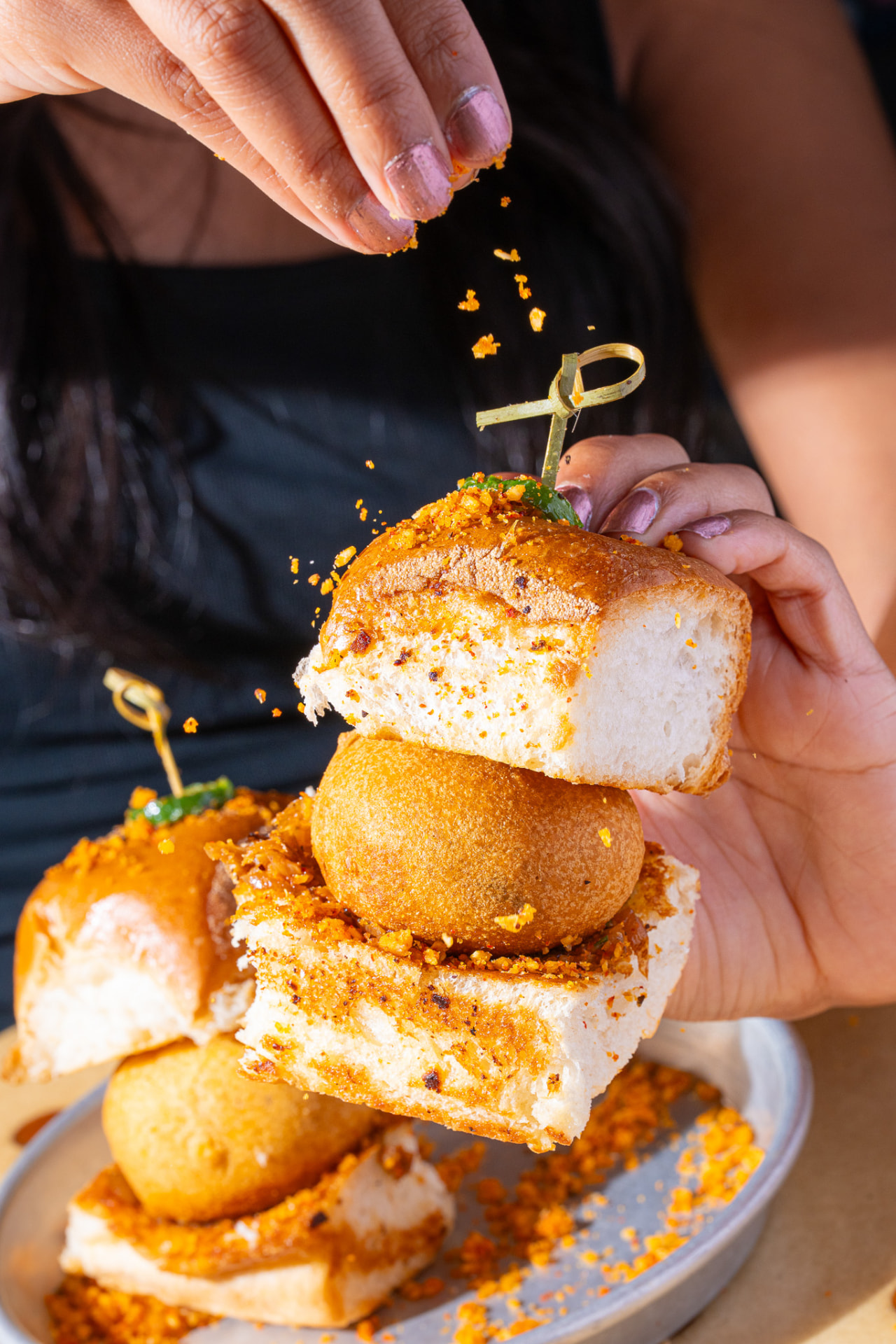Vada Pav, stacked with toasted pav and green chili