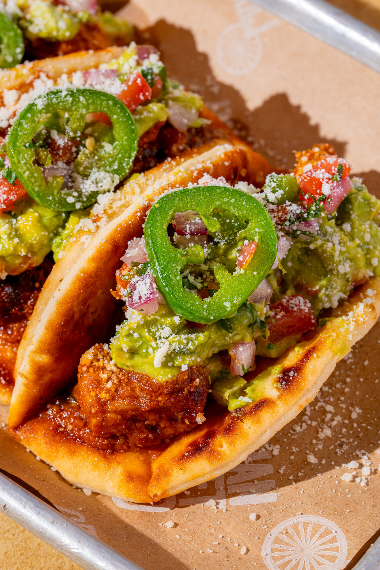 Tacos with guacamole and jalapeno