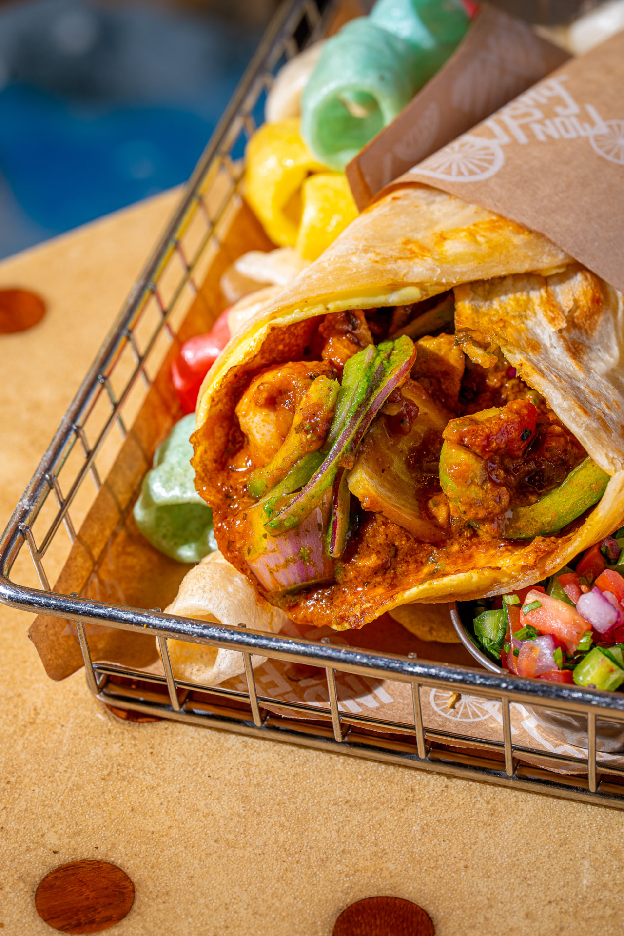 Kathi roll with fryums and pico, in the basket