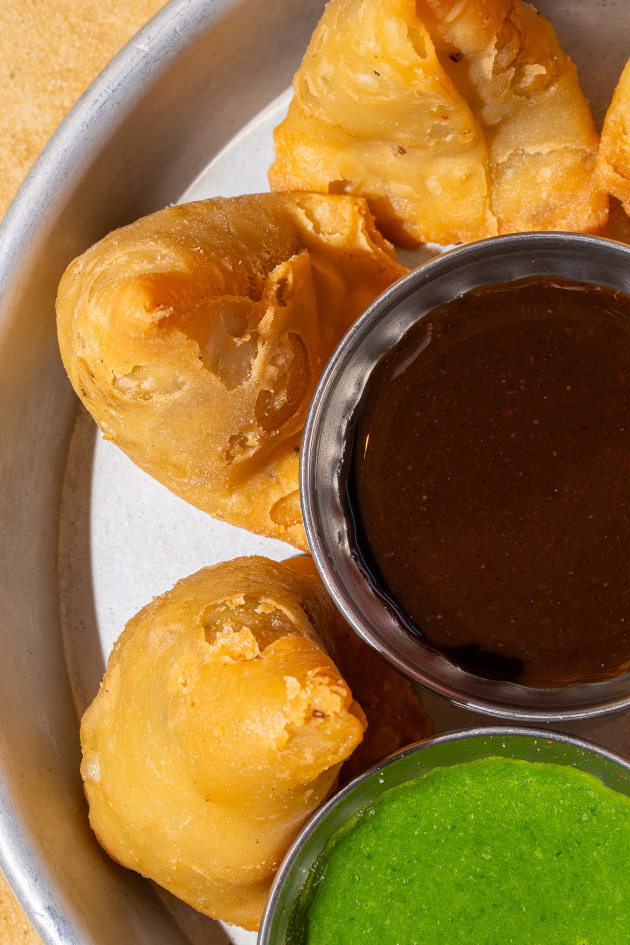 Mini Samosa with tamarind and cilantro chutneys