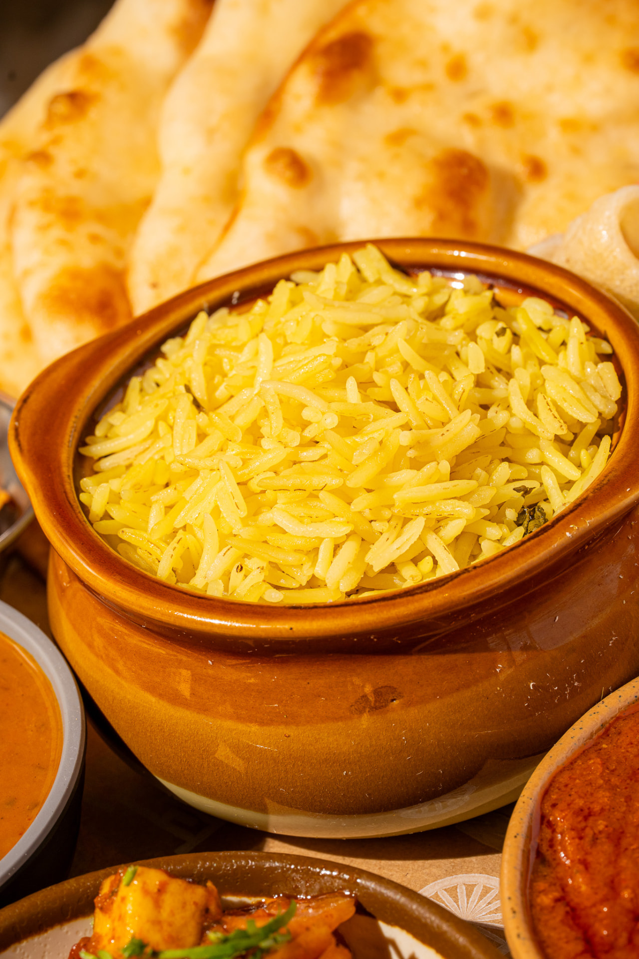 Thali: turmeric rice with naan behind